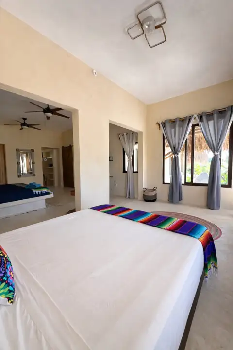 King bed with serape trim in the Atenea Double King room