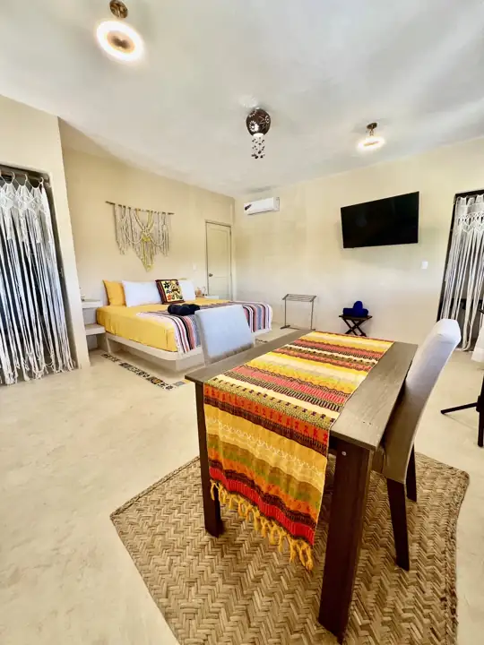 Atenea Double King room with two king beds and Mexican serape textiles, ground floor