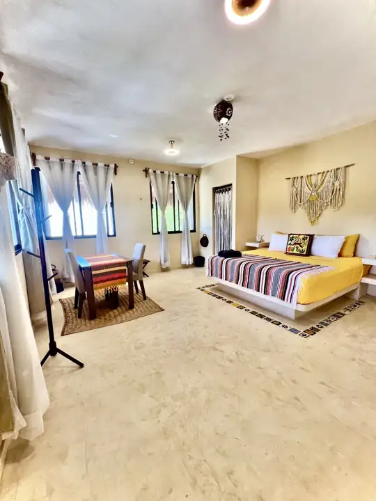 Coco Beach Room with king bed, dining nook and large windows