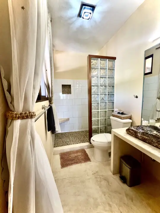 Ensuite bathroom with glass-block shower wall